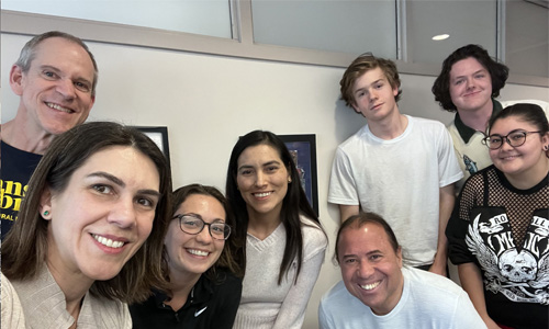 Attendees at Portuguese Language Practice Table taking selfie