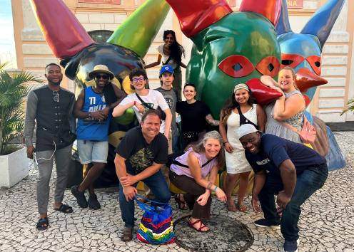 Professors Luciano Tosta and Liz MacGonagle (History, AAAS) in front of the "Casa do Carnaval" with students in the Race, History, and Health Winter Break Program in Salvador, Bahia, Brazil.